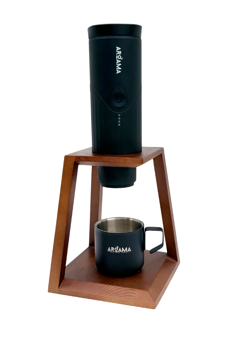 Black coffee maker with a wooden stand and a matching mug on a white background