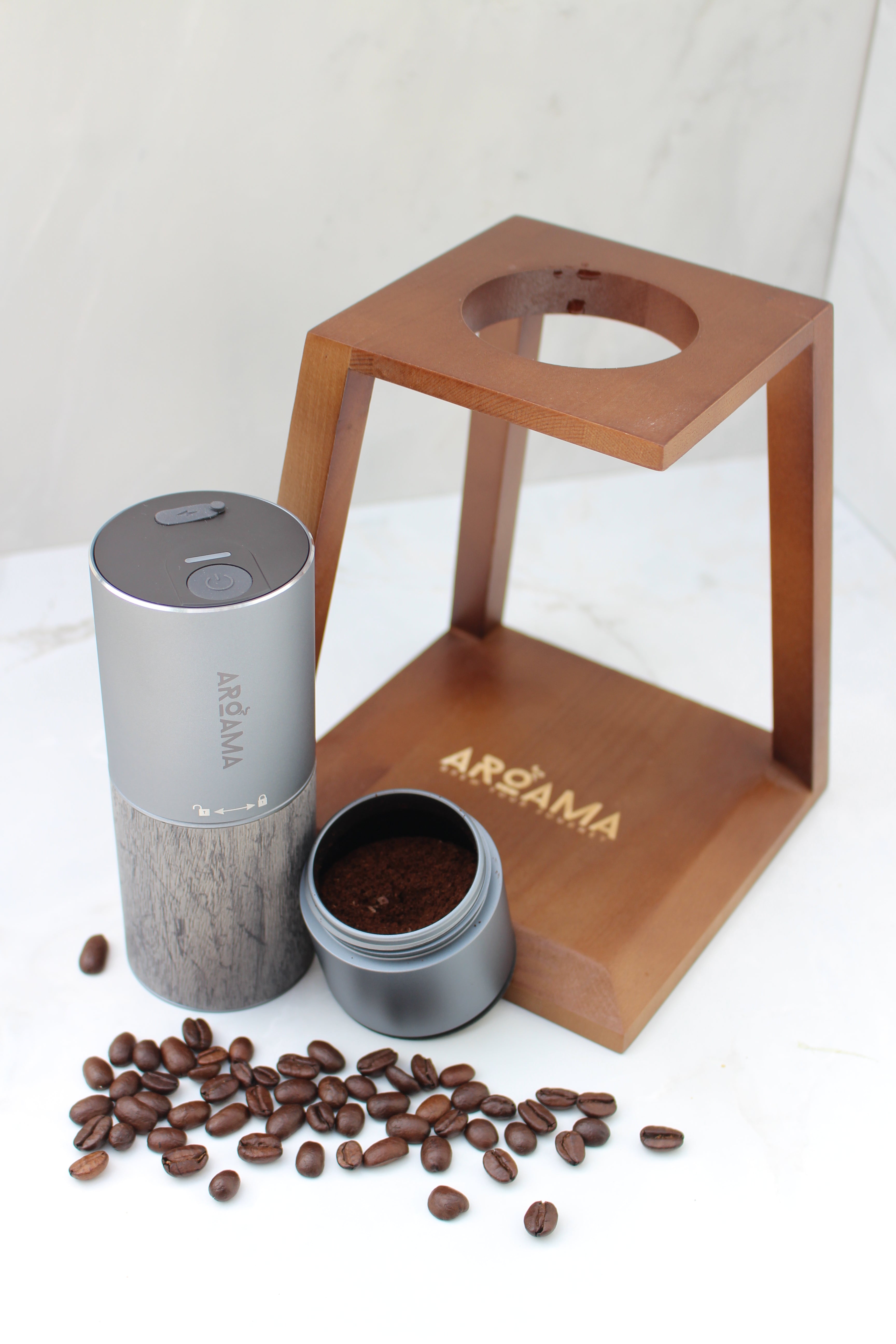 Two coffee containers on a wooden stand with scattered coffee beans on a white background