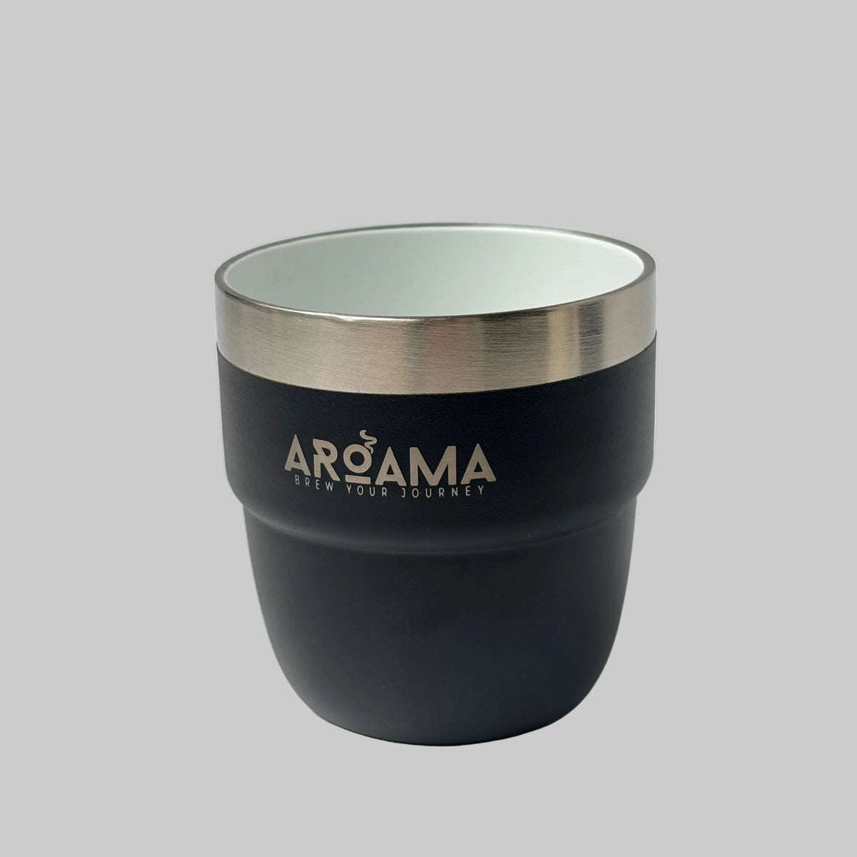 A matte black insulated travel tumbler with a brushed stainless steel rim and the brand name 'AROMA' printed in white on the front, set on a light marble surface.