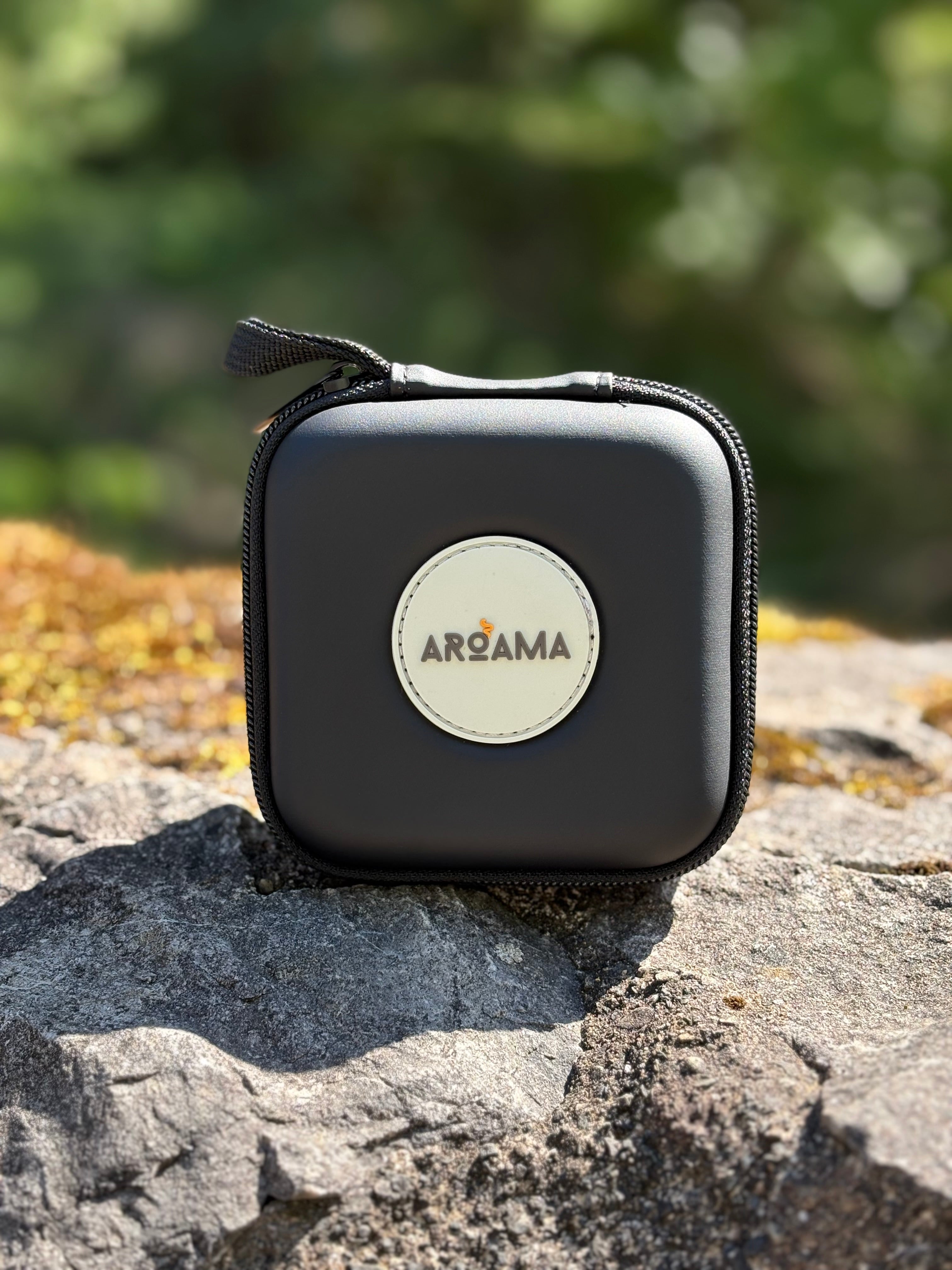 Black carrying case with 'Aroama'' logo on a rock surface