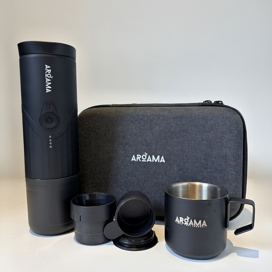 Product shot of Machine, carry case, cup and coffee basket