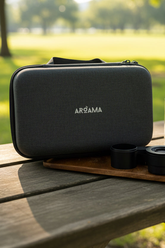 Gray travel coffee kit with 'AROAMA' branding on a marble surface