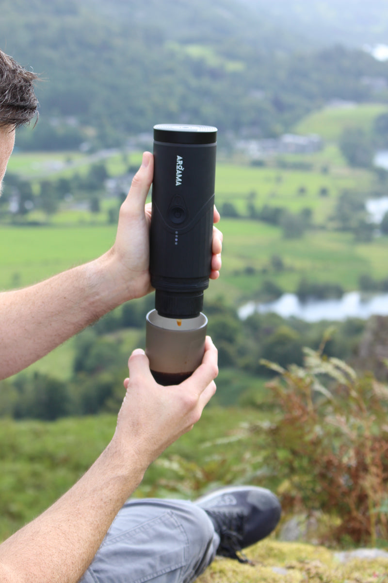 Coffee machine being used at the summit of a fell